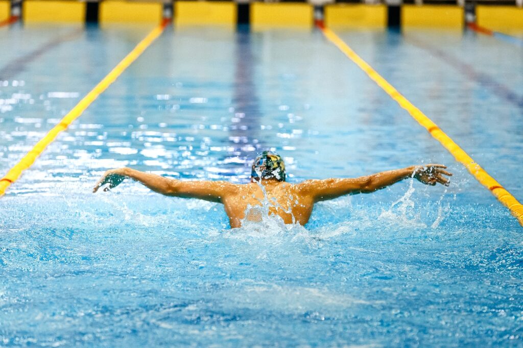 one swimmer athlete swim butterfly stroke