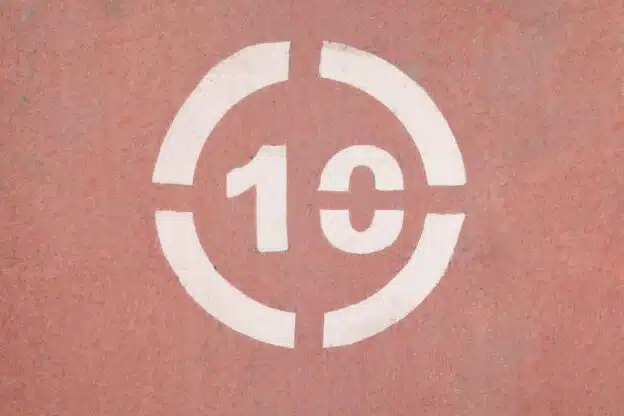Number 10 sign on a red asphalt.